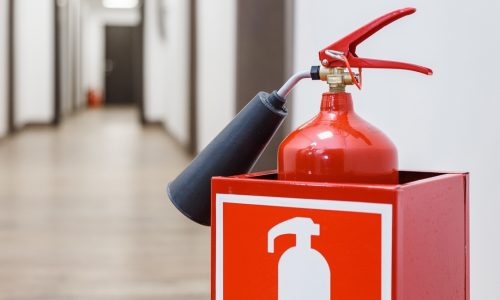 Fire extinguisher in white corridor of the business center; Shutterstock ID 602764454; Purchase Order: -